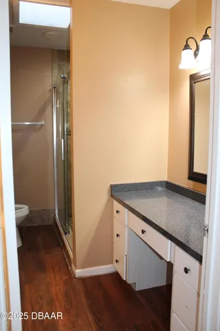 a kitchen with a refrigerator and a sink