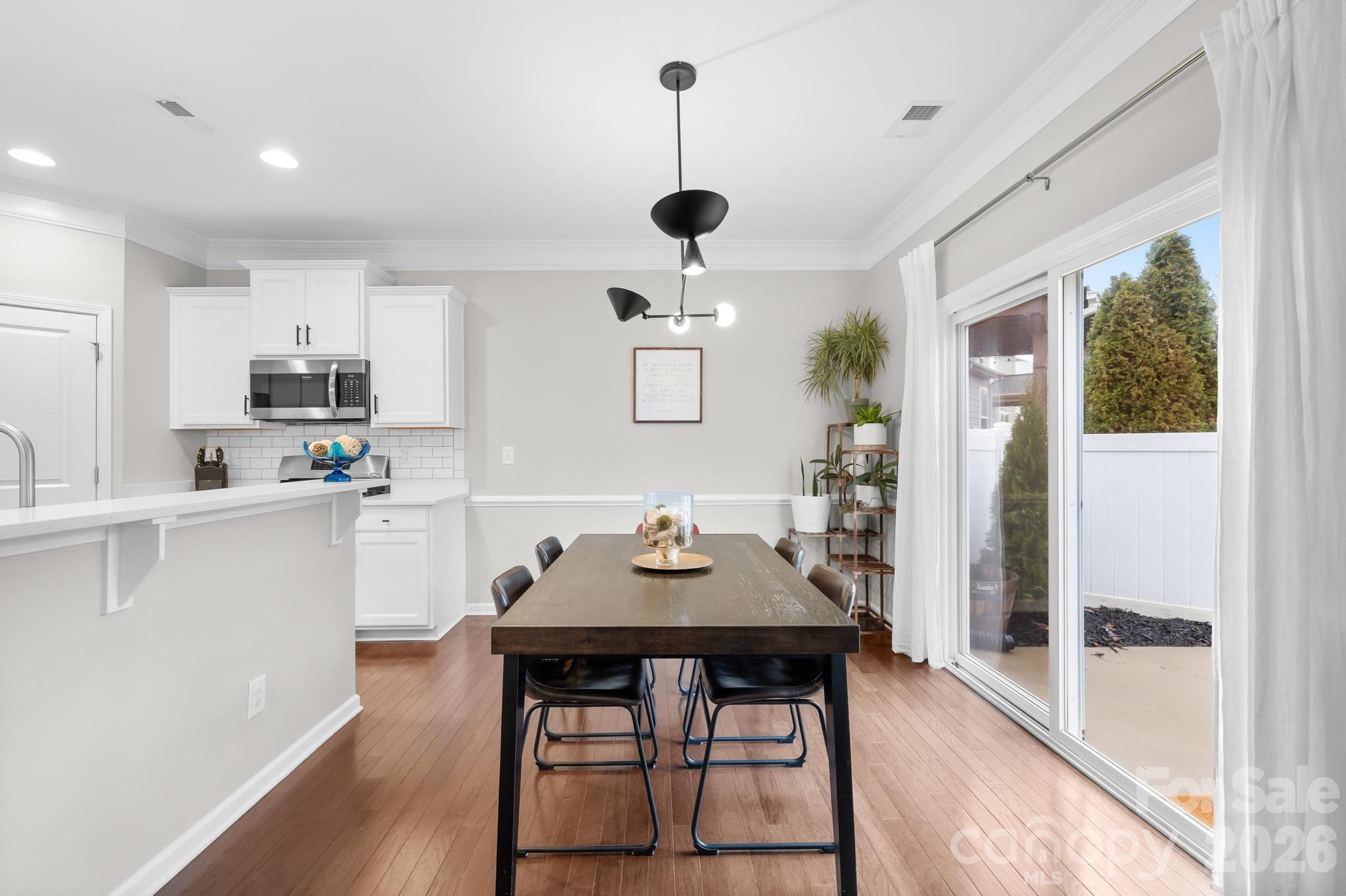 5020 Fenwick Court Lancaster, SC 29720 - Photo 15 of 46 a view of a dining room with furniture and wooden floor