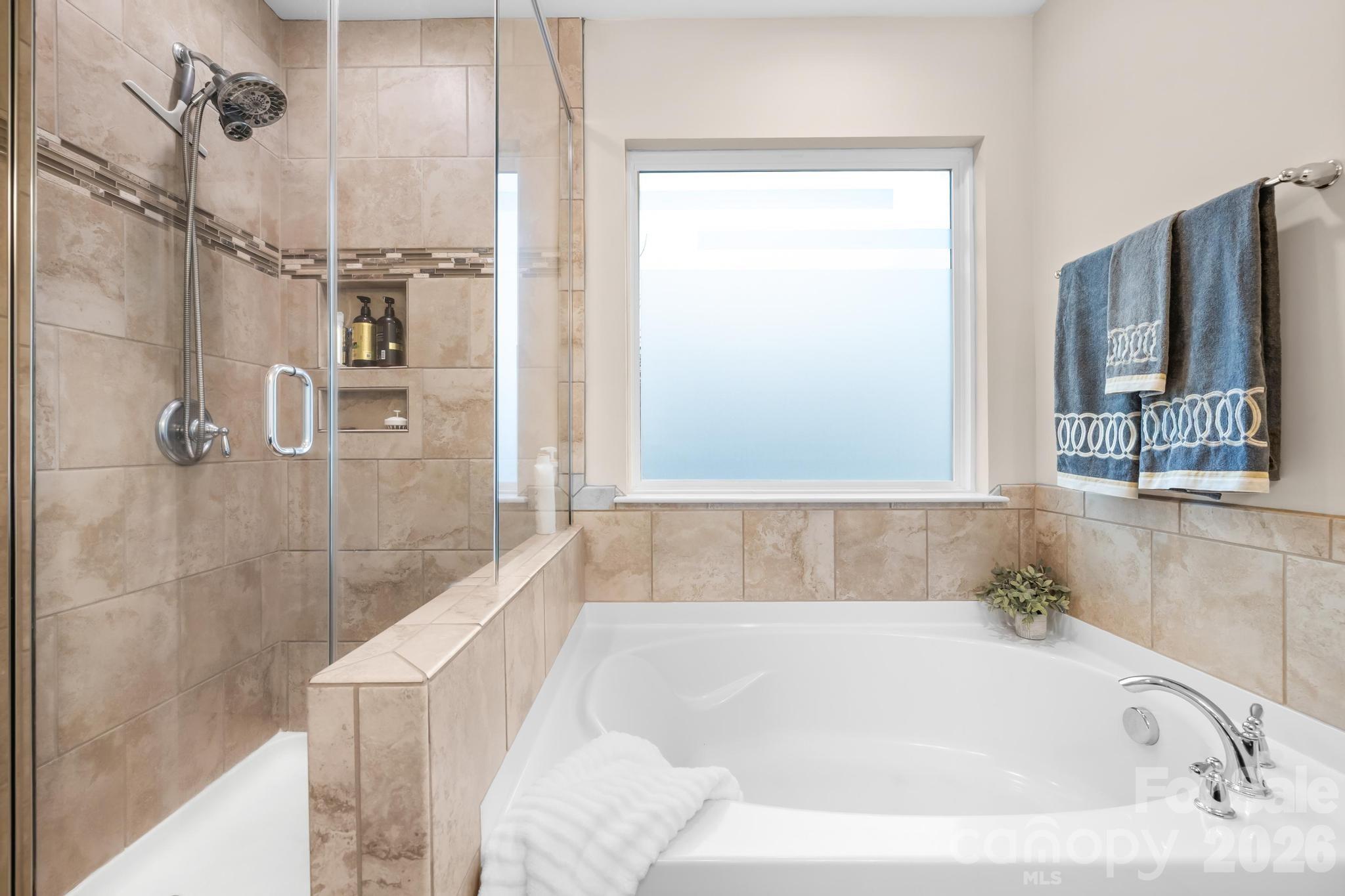 5020 Fenwick Court Lancaster, SC 29720 - Photo 18 of 46 a bathroom with a bathtub and a shower
