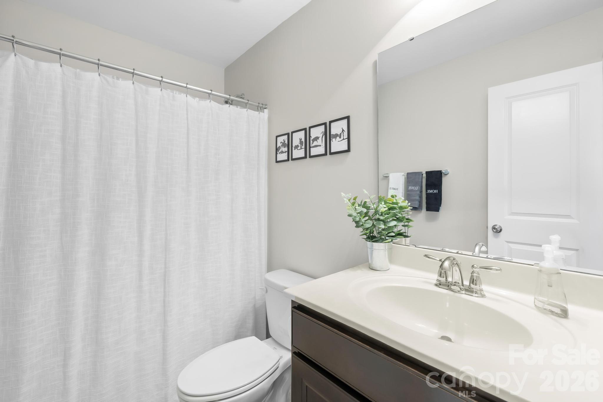 5020 Fenwick Court Lancaster, SC 29720 - Photo 24 of 46 a bathroom with a sink toilet and a mirror