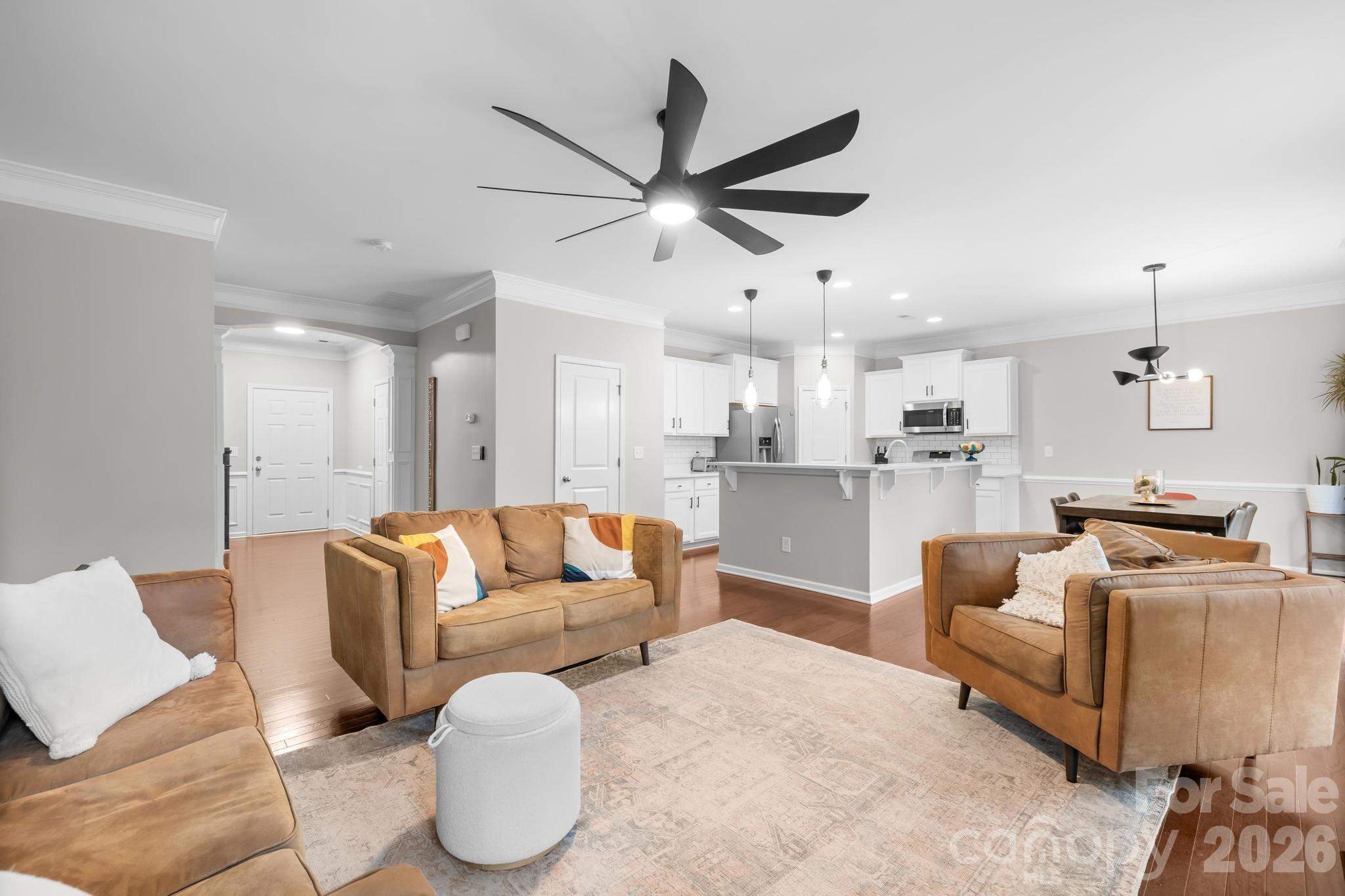 5020 Fenwick Court Lancaster, SC 29720 - Photo 3 of 46 a living room with furniture kitchen view and a chandelier
