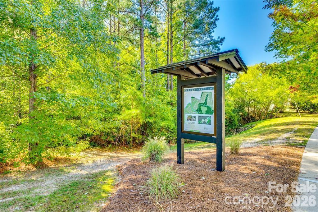 5020 Fenwick Court Lancaster, SC 29720 - Photo 40 of 46 a small pool with a trees in the background