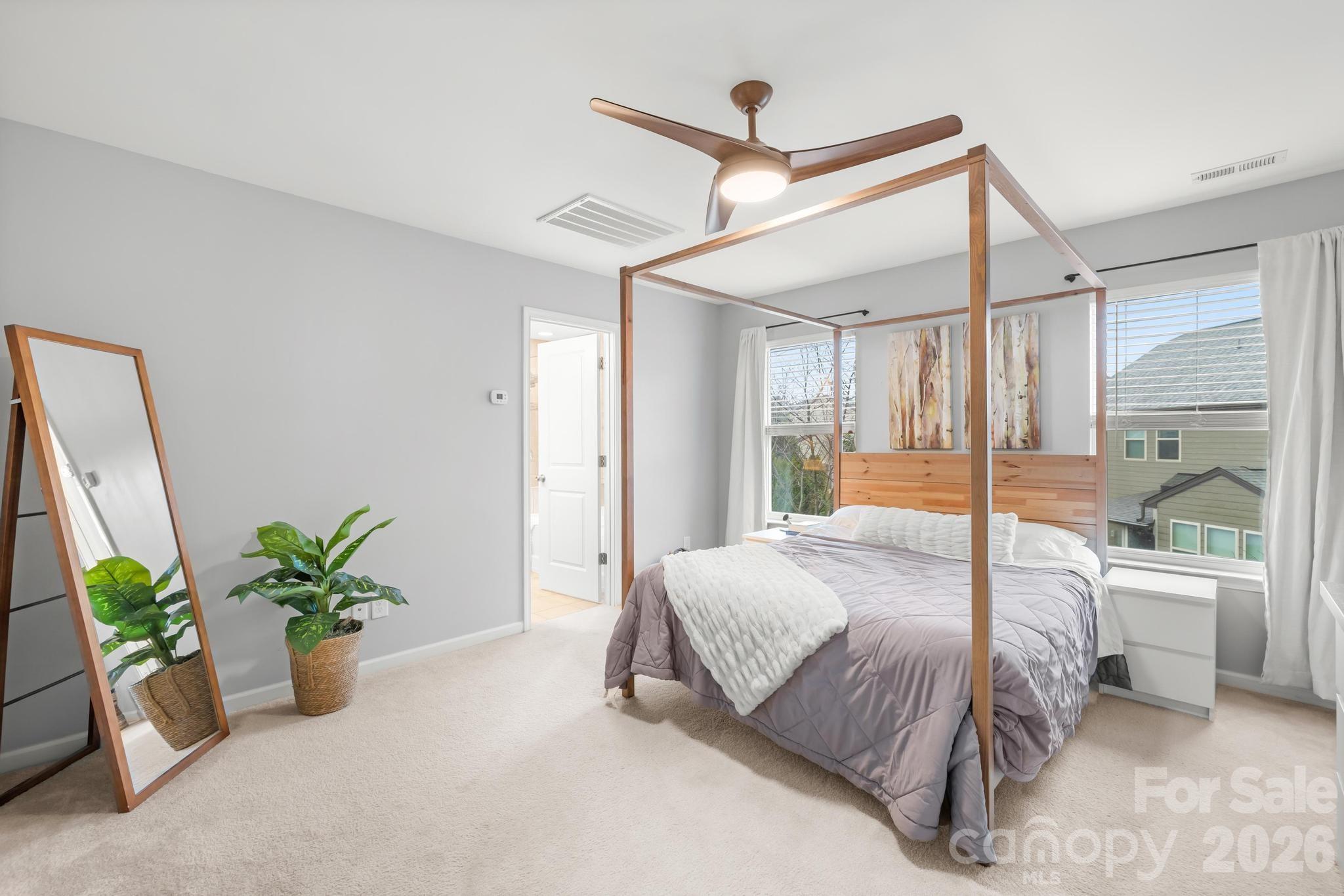 5020 Fenwick Court Lancaster, SC 29720 - Photo 4 of 46 a bedroom with a large bed and a potted plant