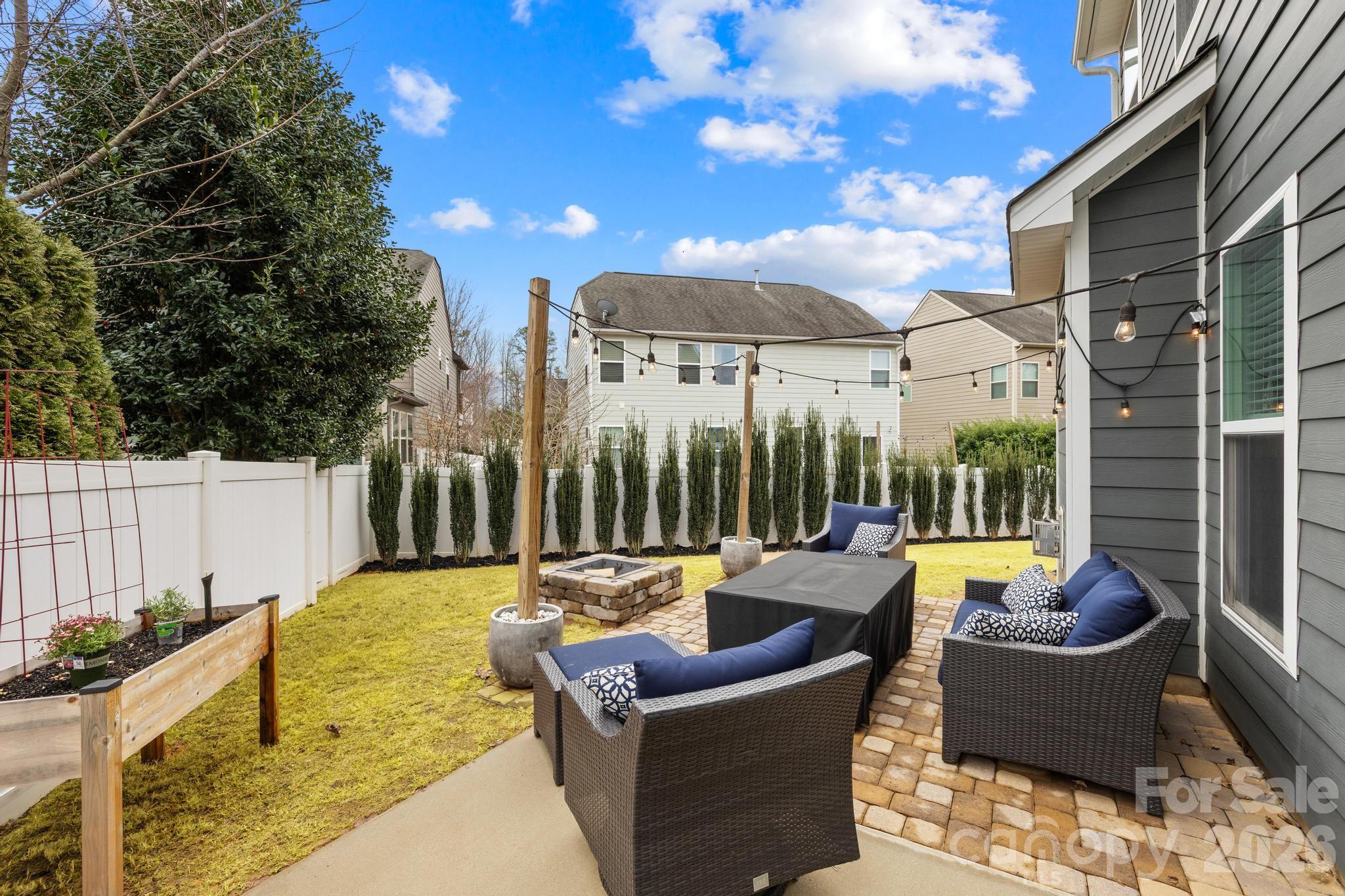 5020 Fenwick Court Lancaster, SC 29720 - Photo 6 of 46 a view of a patio with couches chairs dining table and chairs