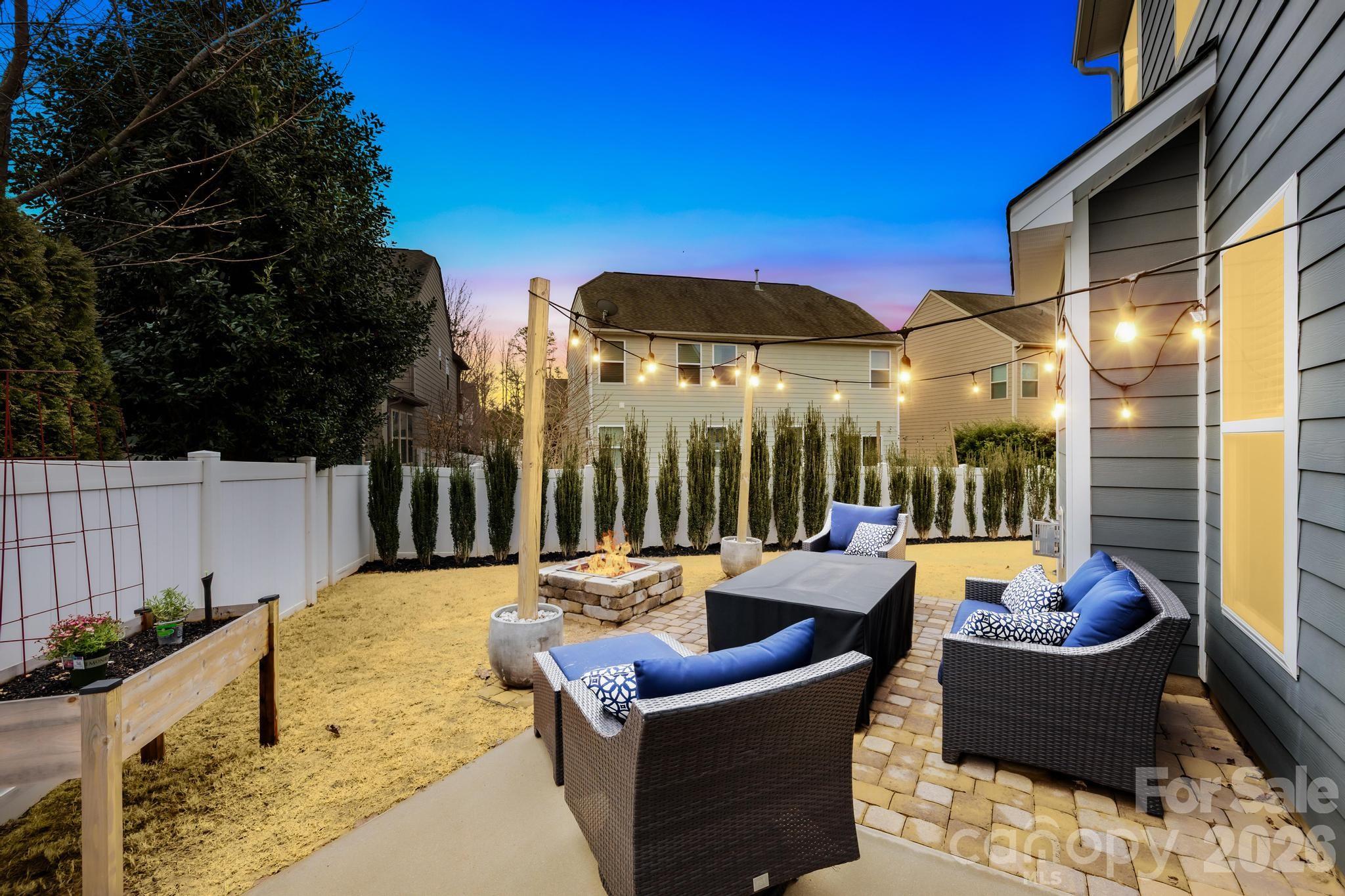 5020 Fenwick Court Lancaster, SC 29720 - Photo 7 of 46 a view of a patio with couches chairs and potted plants