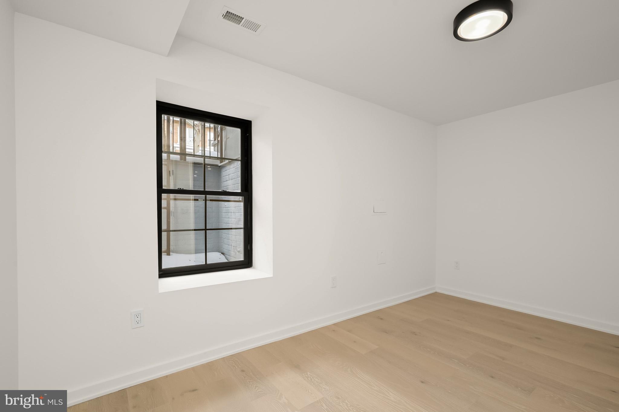 3554 T Street Northwest Washington, DC 20007 - Photo 51 of 57 an empty room with a window
