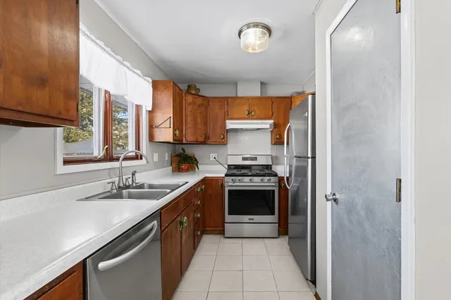 a kitchen with a sink and a window