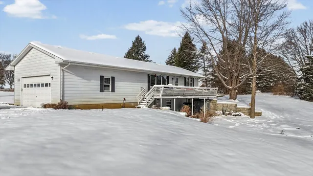 a view of a house with a yard and roof