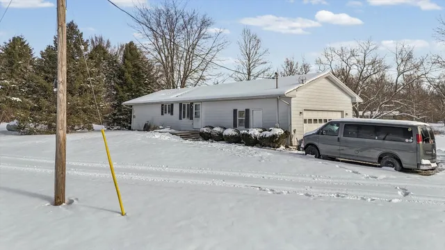 a backyard of a house with yard and seating space