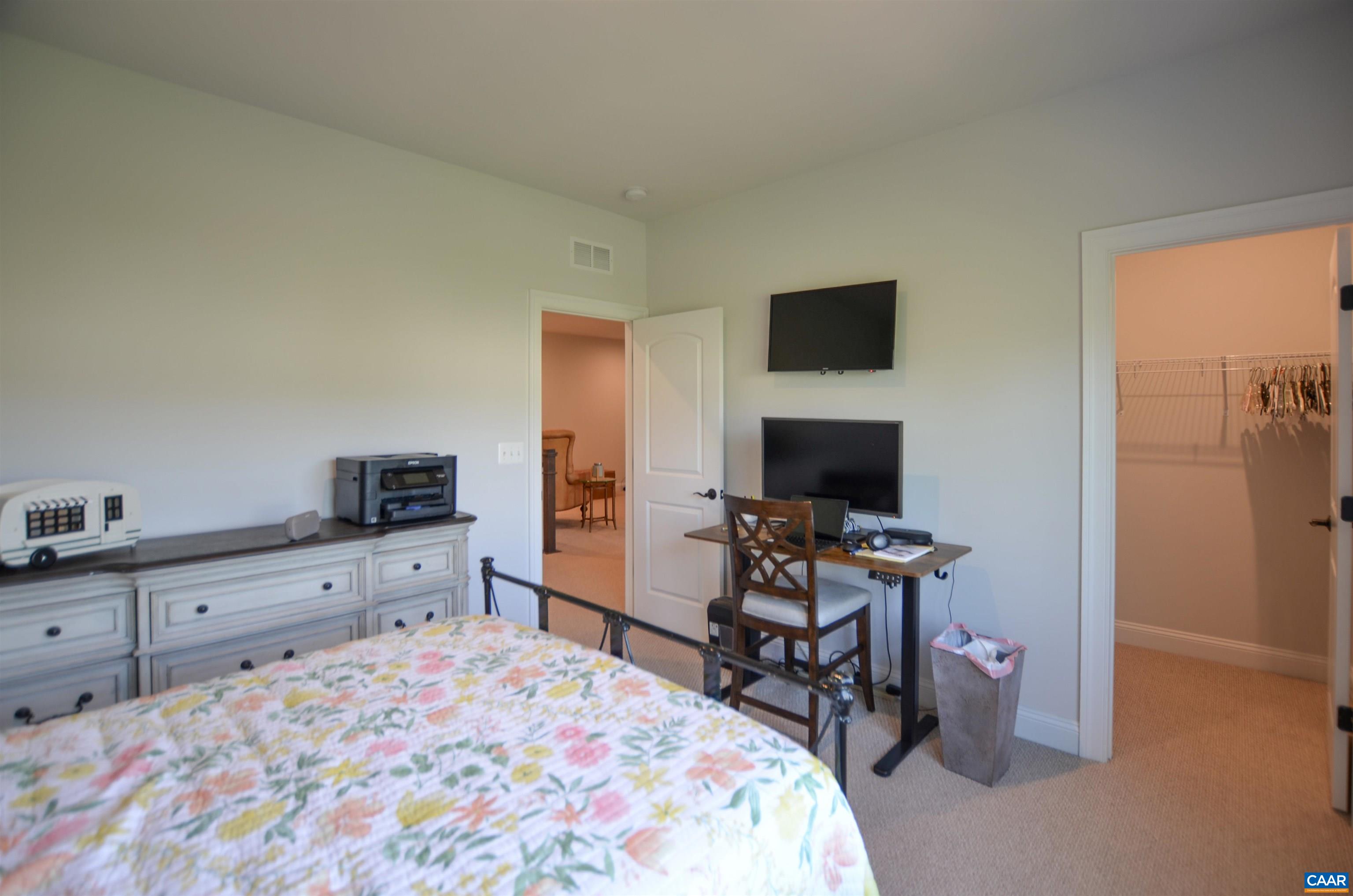 327 Claibourne Road Crozet, VA 22932 - Photo 32 of 36 a bedroom with a bed and a computer on a table