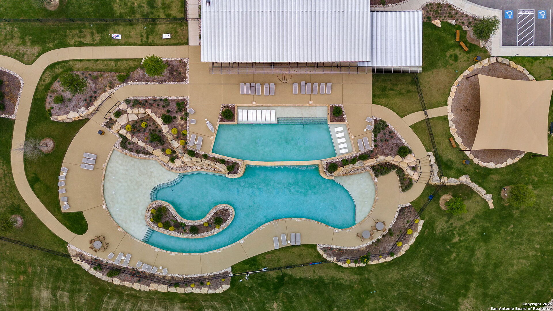 5386 Ranch Road 1376, Unit 114 Fredericksburg, TX 78624 - Photo 19 of 29 an aerial view of a swimming pool and outdoor space