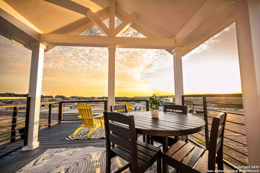5386 Ranch Road 1376, Unit 114 Fredericksburg, TX 78624 - Photo 4 of 29 an outdoor view with a dining table and chairs