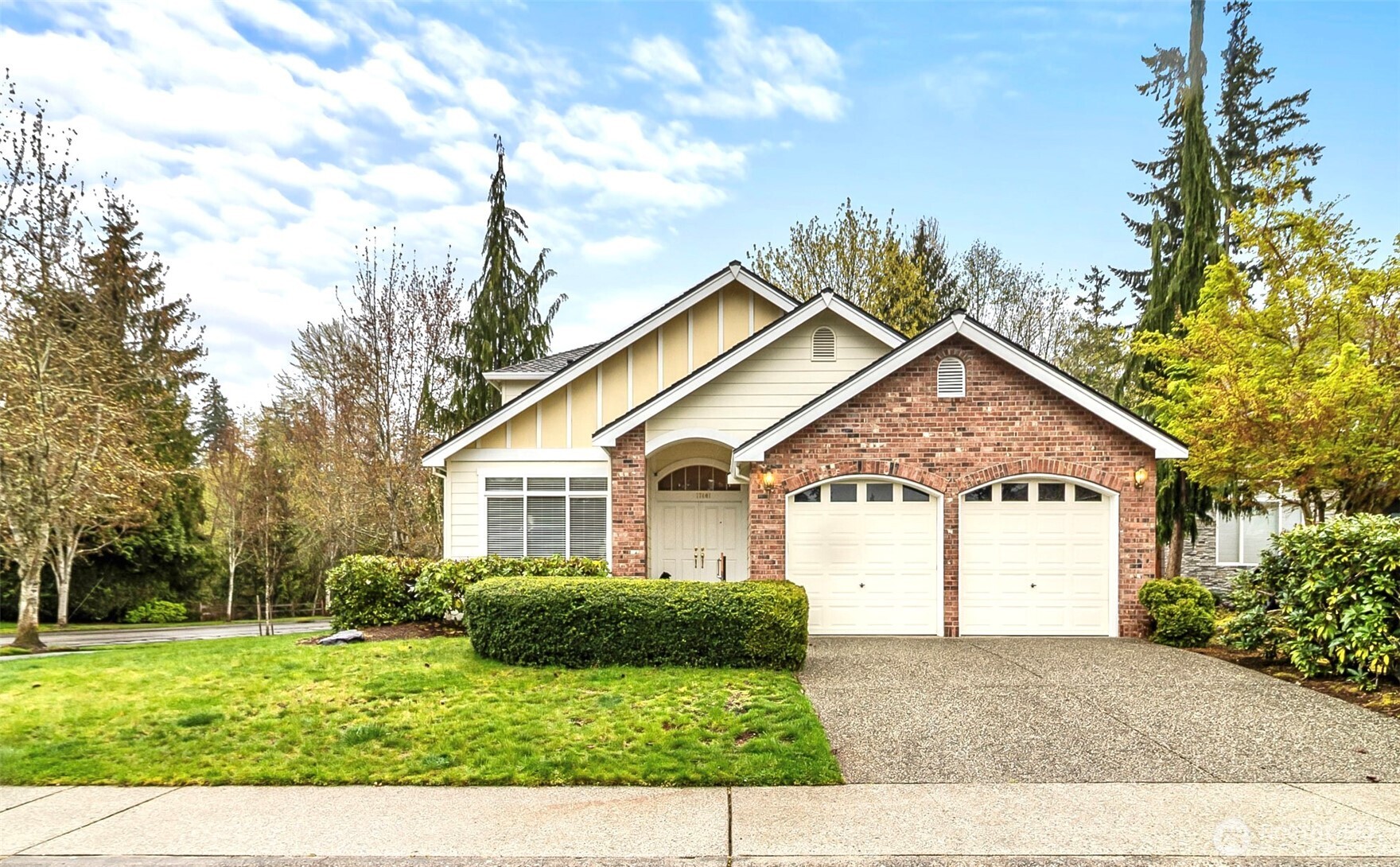 17401 33rd Drive Southeast Bothell, WA 98012 - Photo 1 of 39 a view of a yard in front of a house with plants and large tree