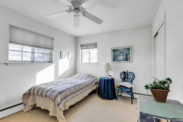 a bedroom with a bed and a table in it