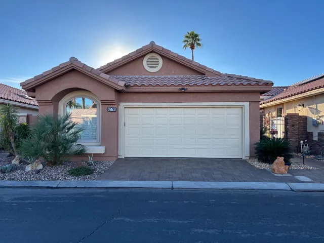a front view of a house with yard