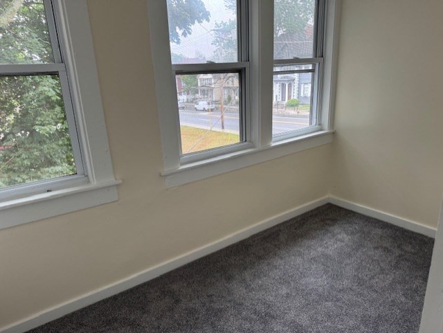 43 Nesmith Street, Unit 7 Lowell, MA 01852 - Photo 3 of 9 an empty room with a window