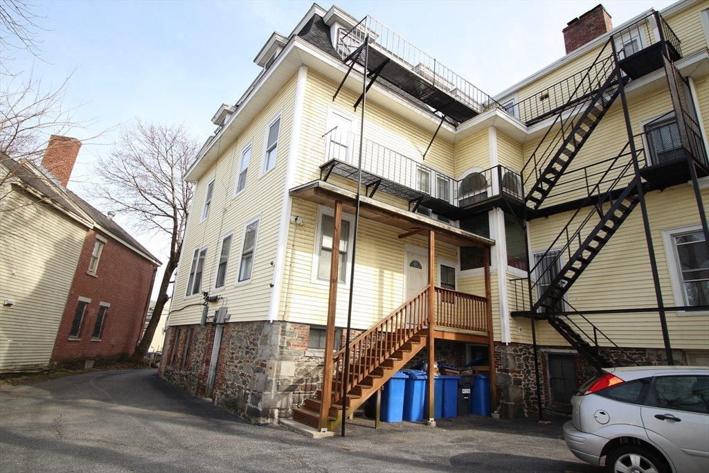 43 Nesmith Street, Unit 7 Lowell, MA 01852 - Photo 8 of 9 a view of a house with a street