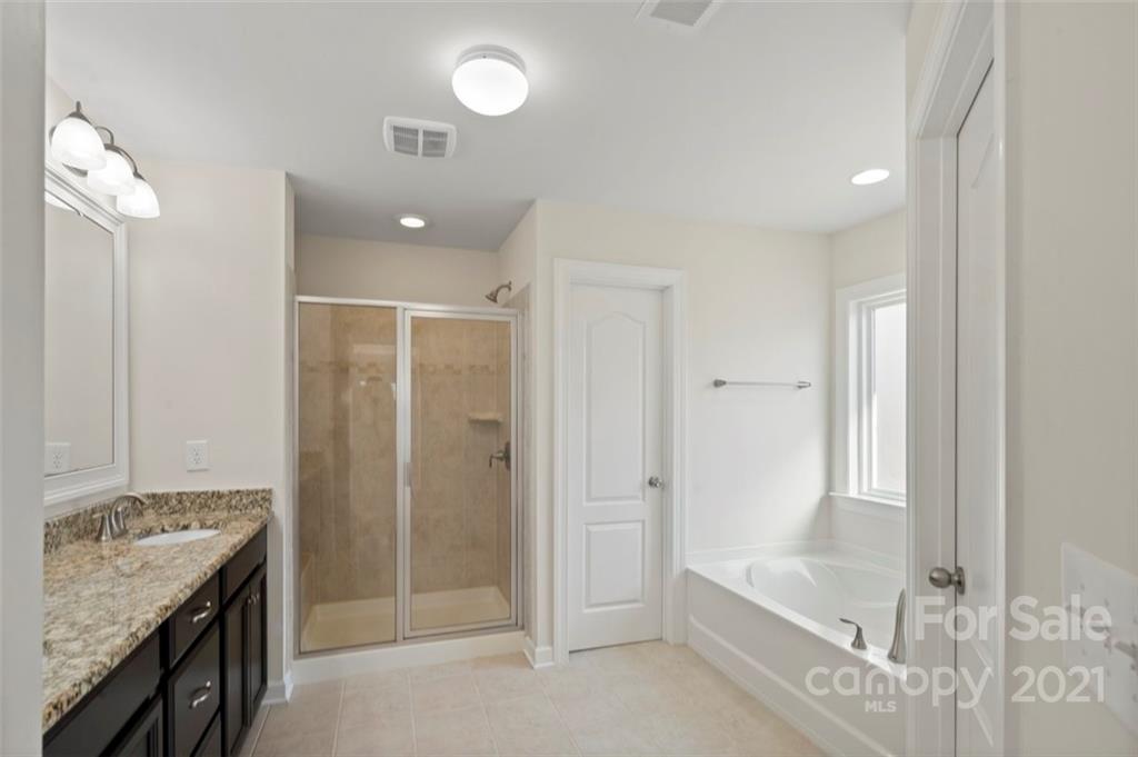4331 Oxford Mill Road Waxhaw, NC 28173 - Photo 27 of 48 a bathroom with a sink a toilet and shower