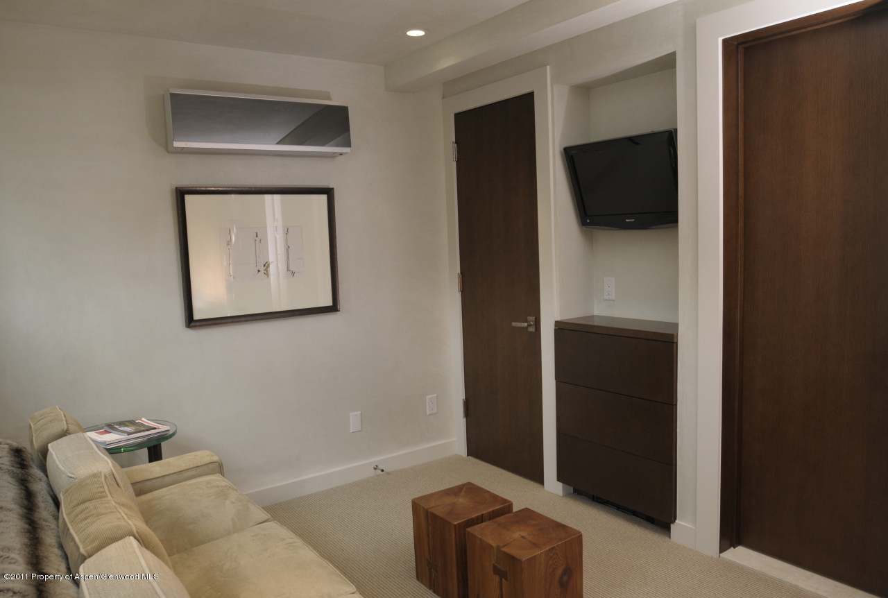 701 South Monarch Street, Unit 2 Aspen, CO 81611 - Photo 11 of 13 a living room with furniture and a flat screen tv
