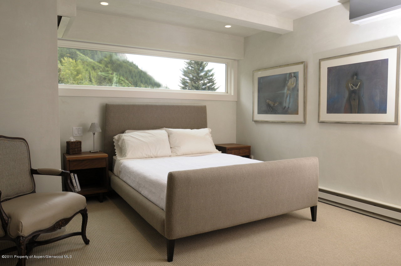 701 South Monarch Street, Unit 2 Aspen, CO 81611 - Photo 7 of 13 a bedroom with a bed and a window