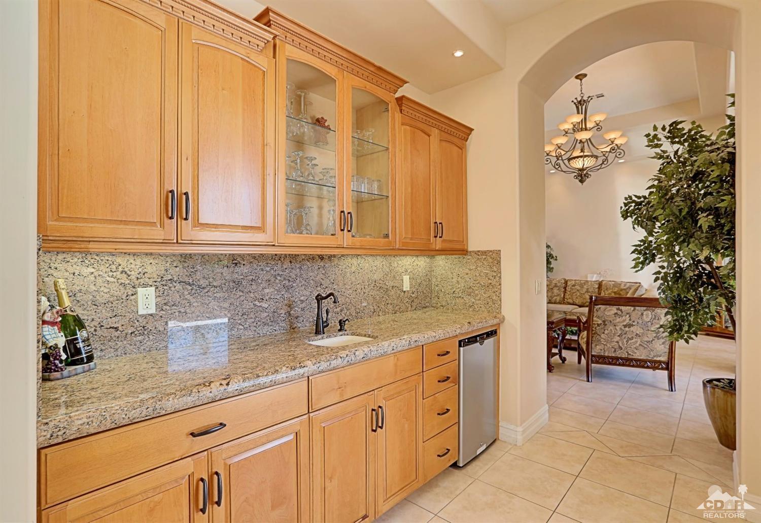 36844 Palm View Road Rancho Mirage, CA 92270 - Photo 26 of 48 a kitchen with stainless steel appliances granite countertop a sink a stove and cabinets