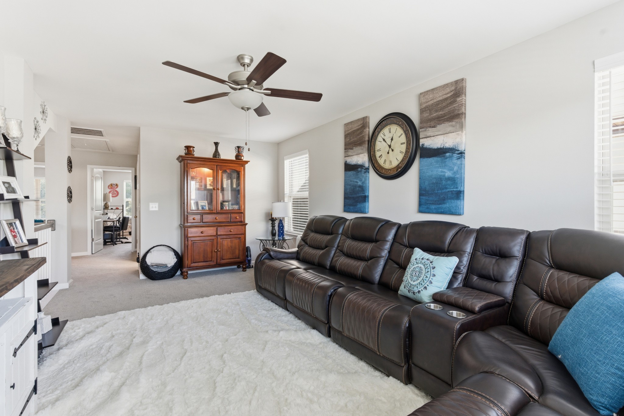 140 Rising Pvt Lane Gallatin, TN 37066 - Photo 15 of 29 a living room with furniture a clock and a ceiling fan