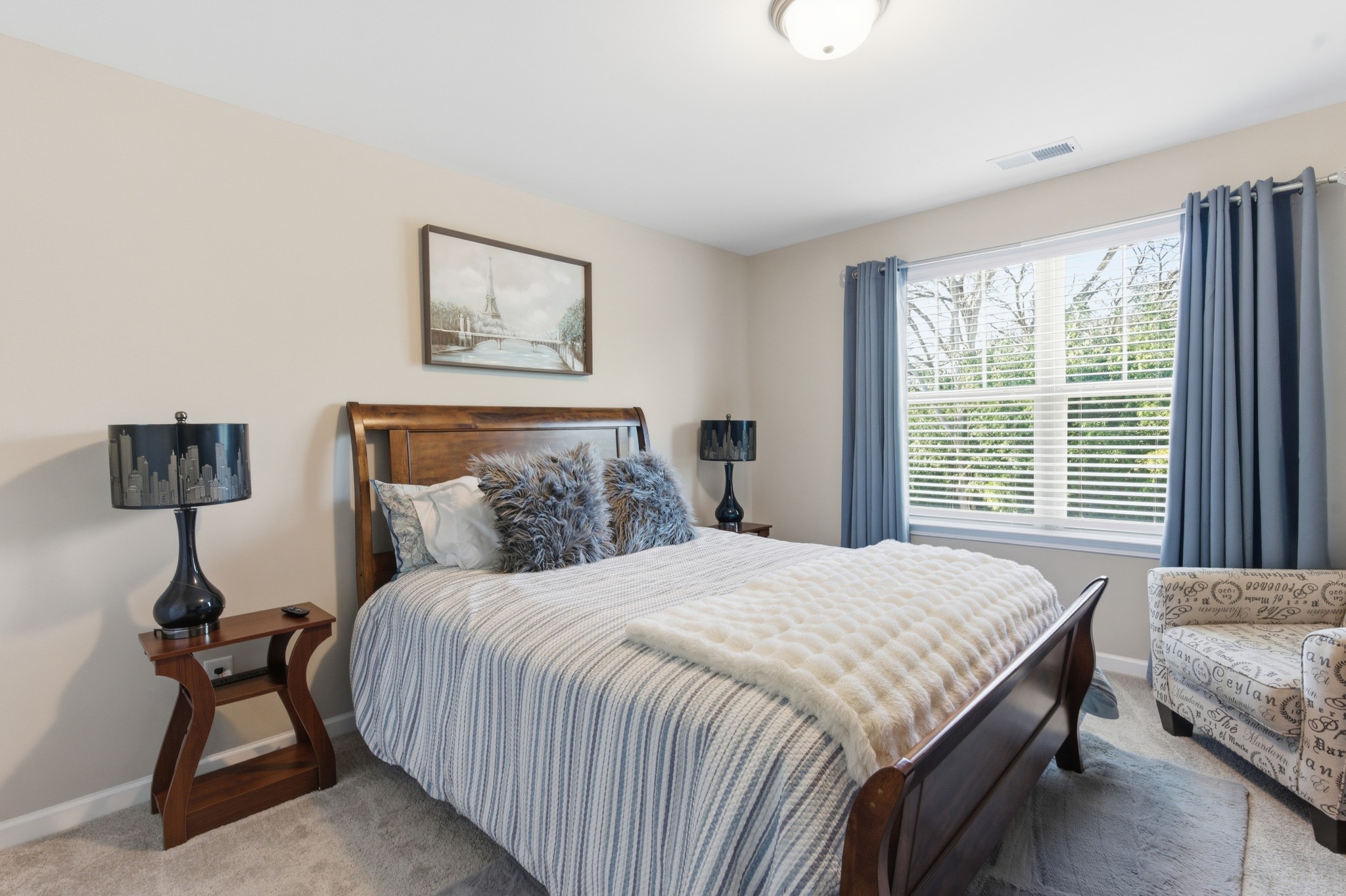 140 Rising Pvt Lane Gallatin, TN 37066 - Photo 19 of 29 a bedroom with a bed and a lamp on table