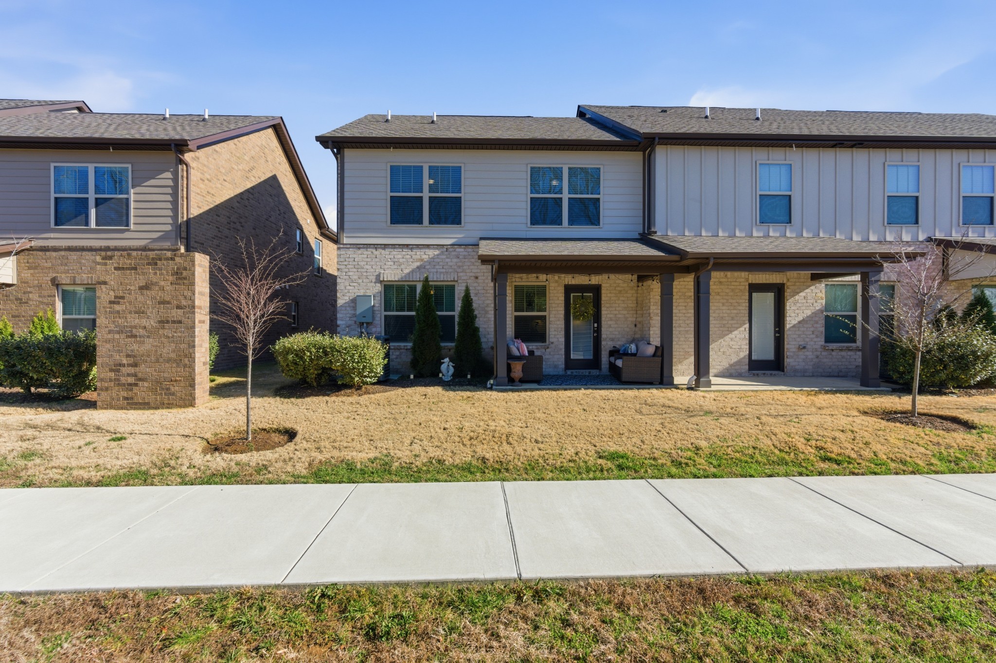 140 Rising Pvt Lane Gallatin, TN 37066 - Photo 25 of 29 a front view of a house with a garden and patio