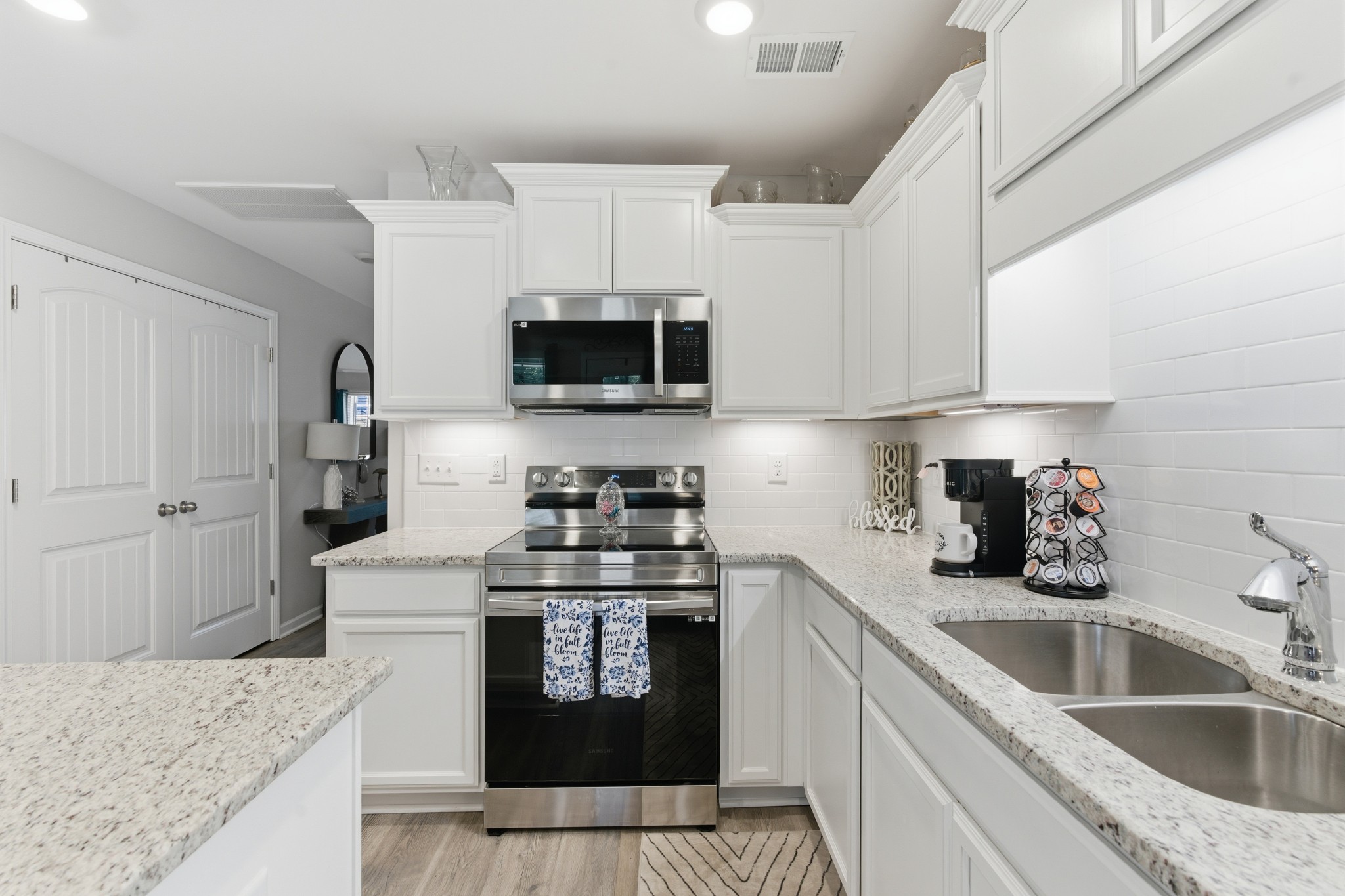 140 Rising Pvt Lane Gallatin, TN 37066 - Photo 7 of 29 a kitchen with stainless steel appliances granite countertop a sink stove and refrigerator