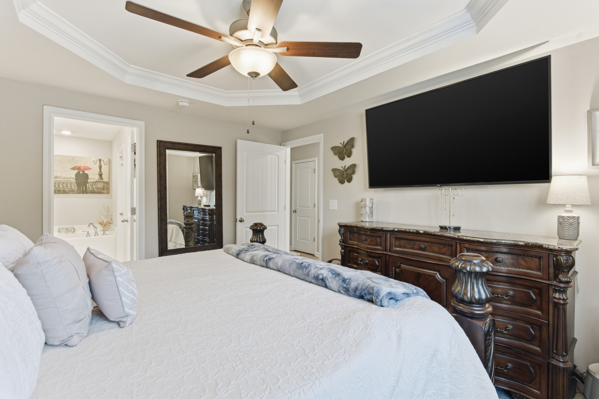 140 Rising Pvt Lane Gallatin, TN 37066 - Photo 10 of 29 a bedroom with a bed and a flat screen tv