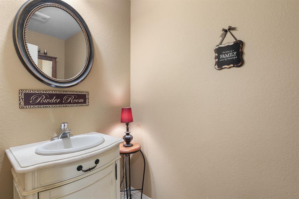 4504 Jennings Avenue Wichita Falls, TX 76310 - Photo 19 of 26 a bathroom with a sink and a mirror