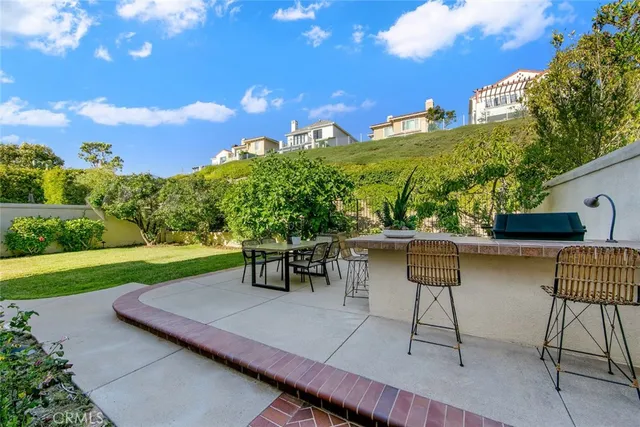 a view of a chairs and table in patio