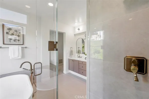 a bathroom with a sink a bathtub and shower