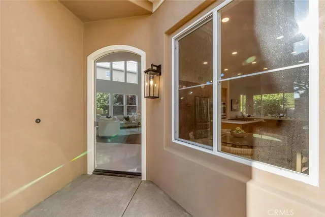a view of a room that has a large window and shower