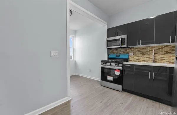 a kitchen with a stove and a microwave