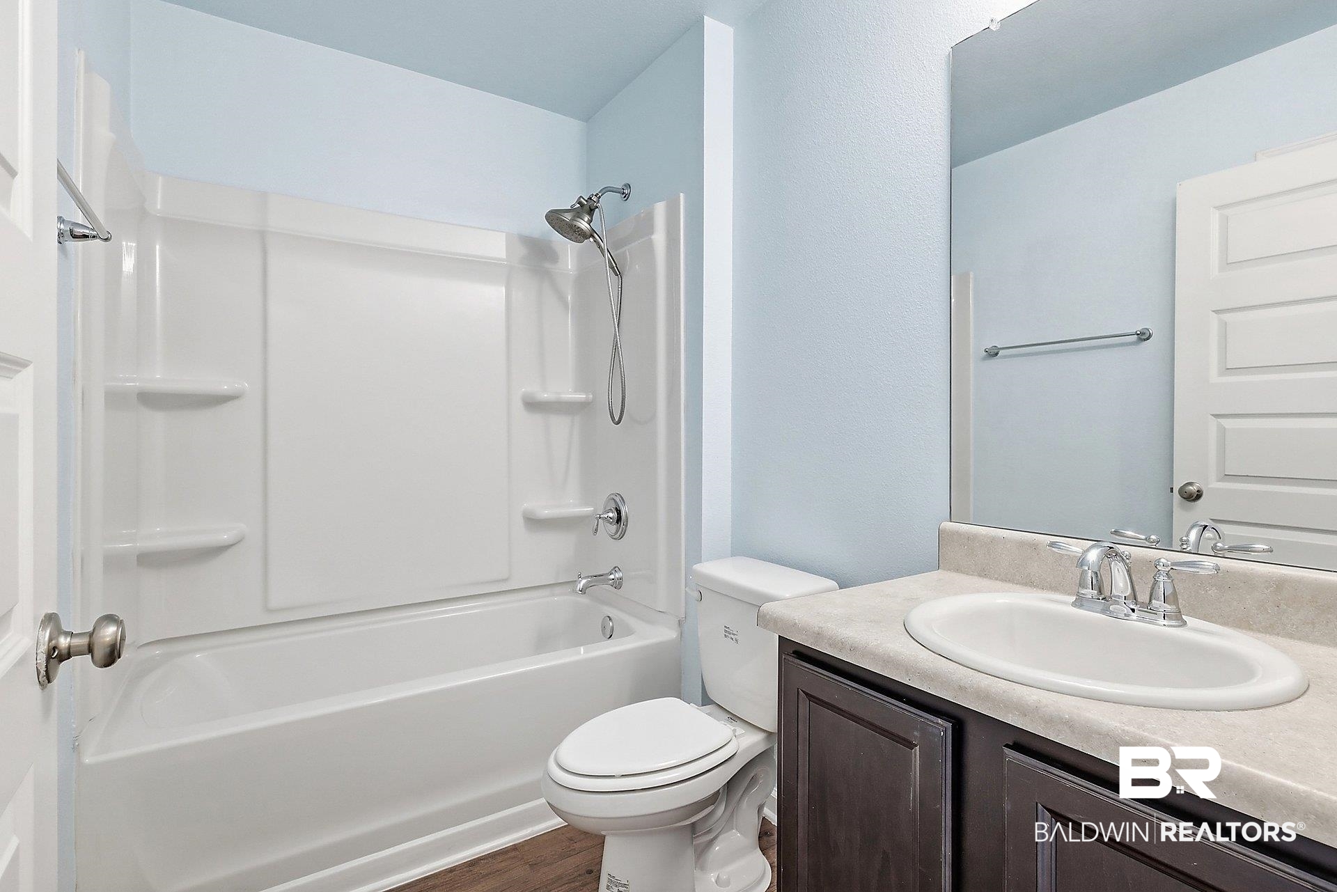 983 Summerton Drive Foley, AL 36535 - Photo 21 of 25 Bathroom with vanity, shower / washtub combination, and dark wood-style flooring