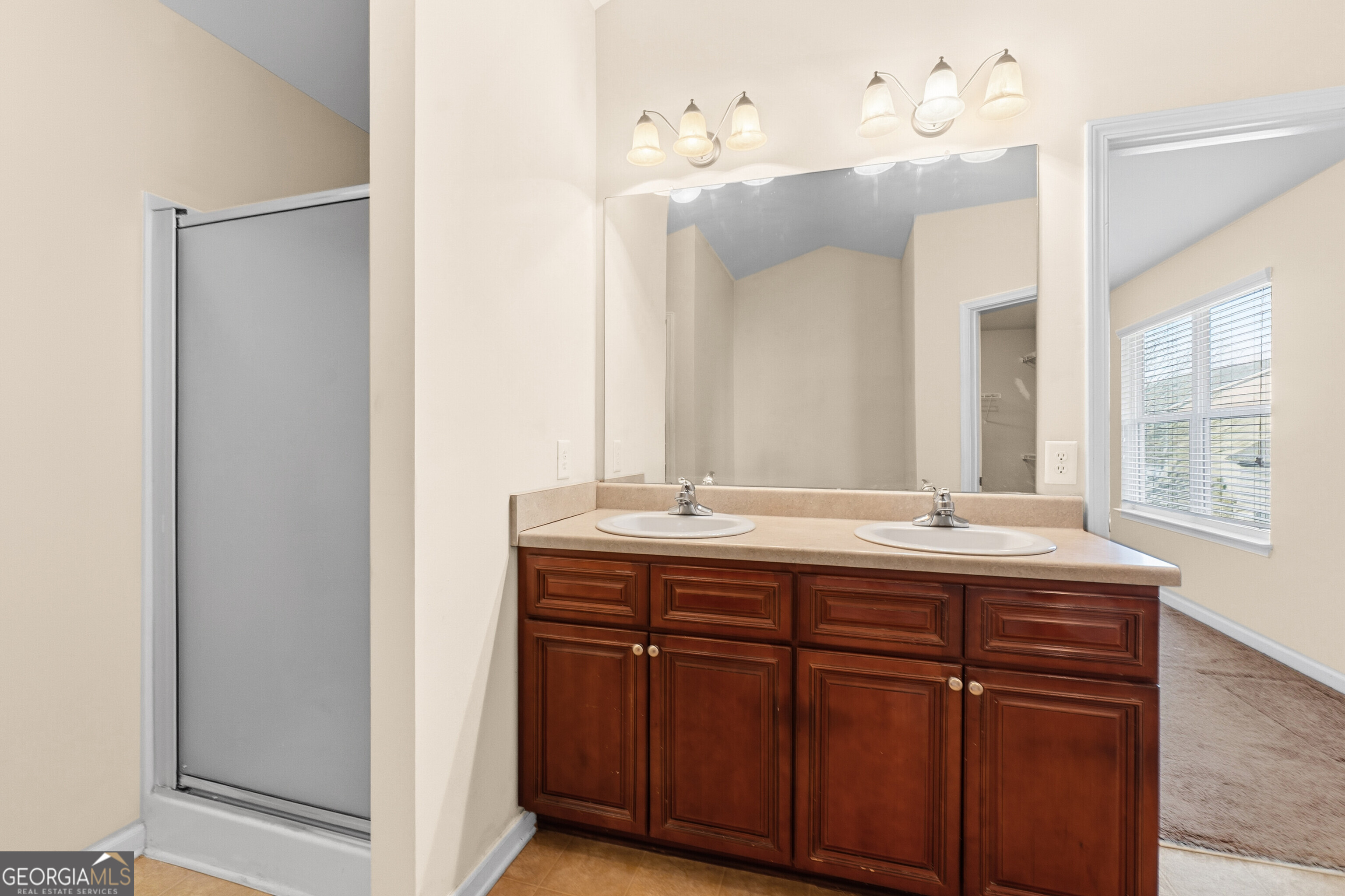 102 Steeple Court Perry, GA 31069 - Photo 23 of 37 a bathroom with a granite countertop sink and a mirror