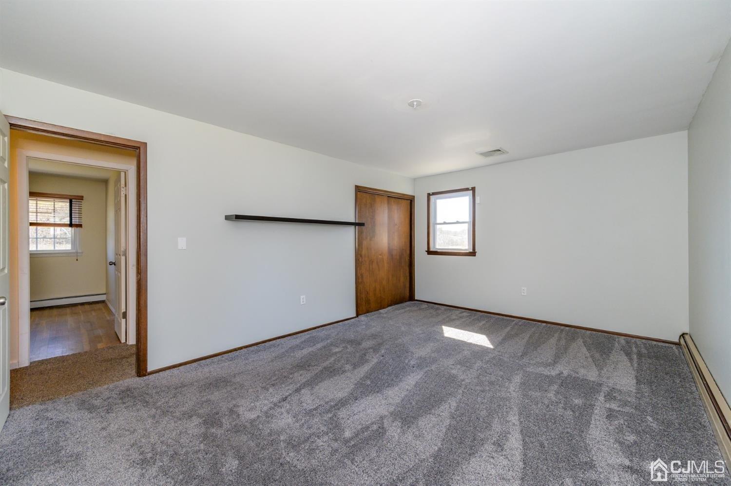 627 Lloyd Road Aberdeen, NJ 07747 - Photo 11 of 32 an empty room with windows