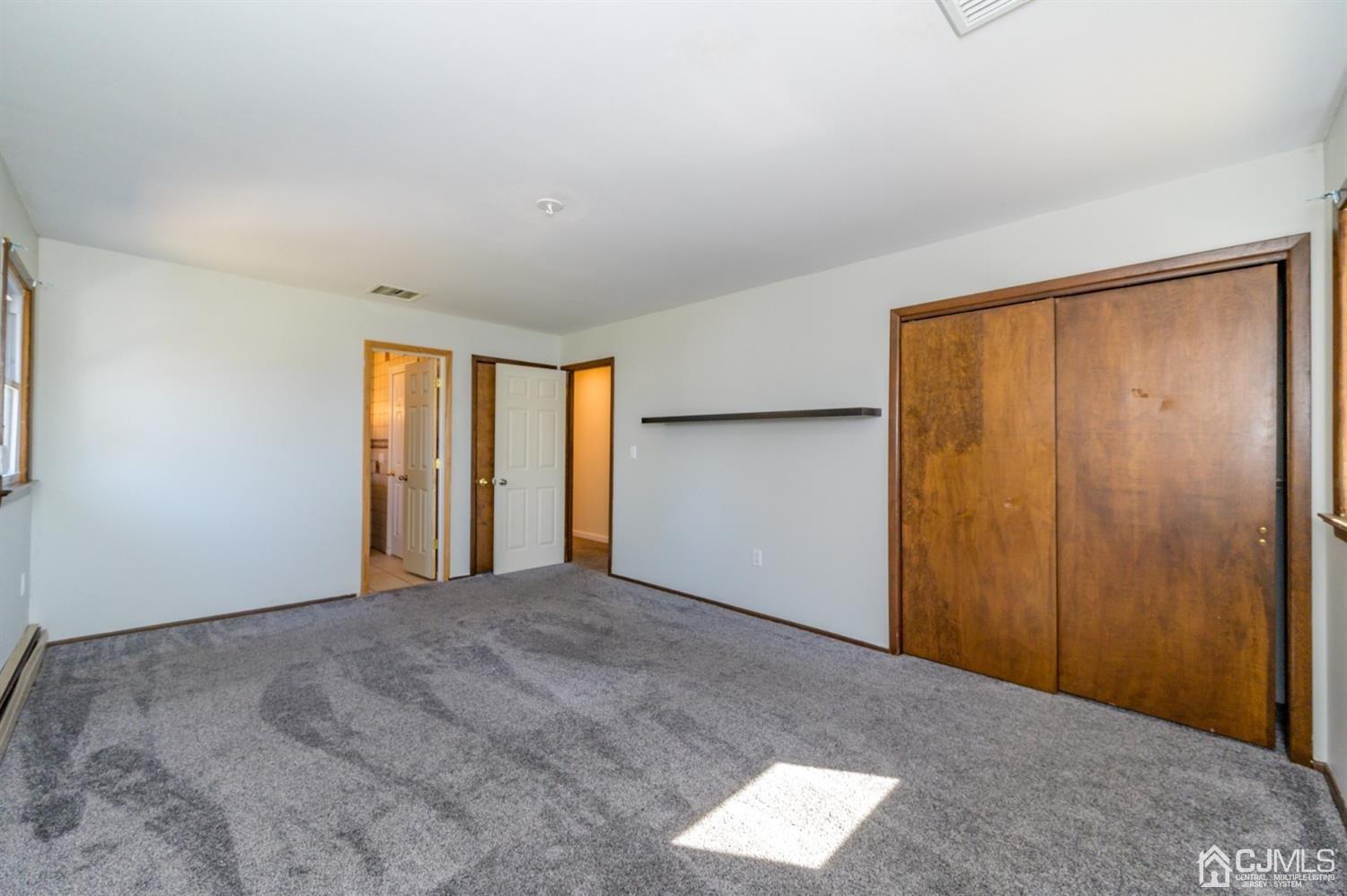 627 Lloyd Road Aberdeen, NJ 07747 - Photo 12 of 32 a view of an empty room with window