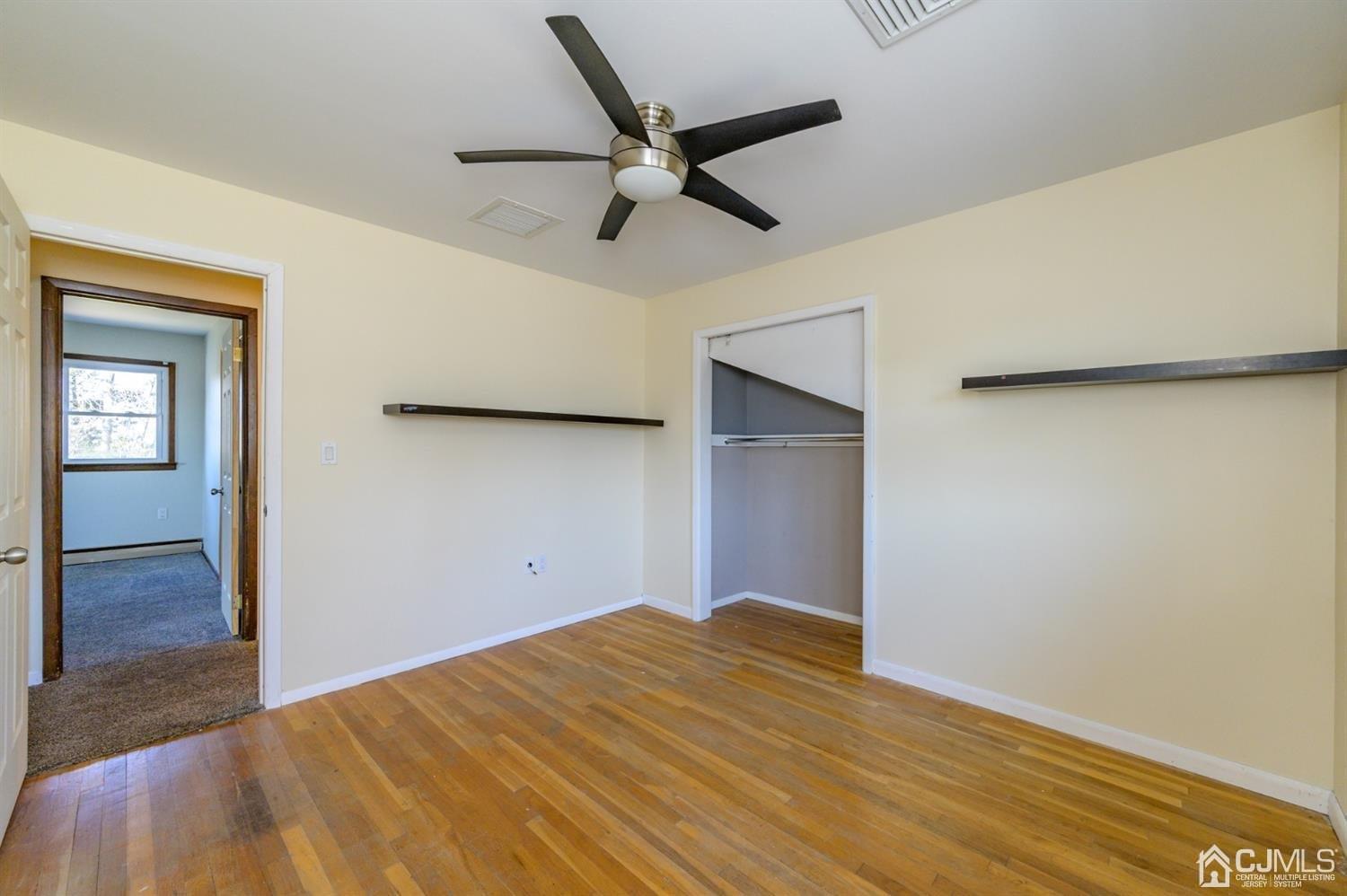 627 Lloyd Road Aberdeen, NJ 07747 - Photo 17 of 32 a view of empty room with wooden floor