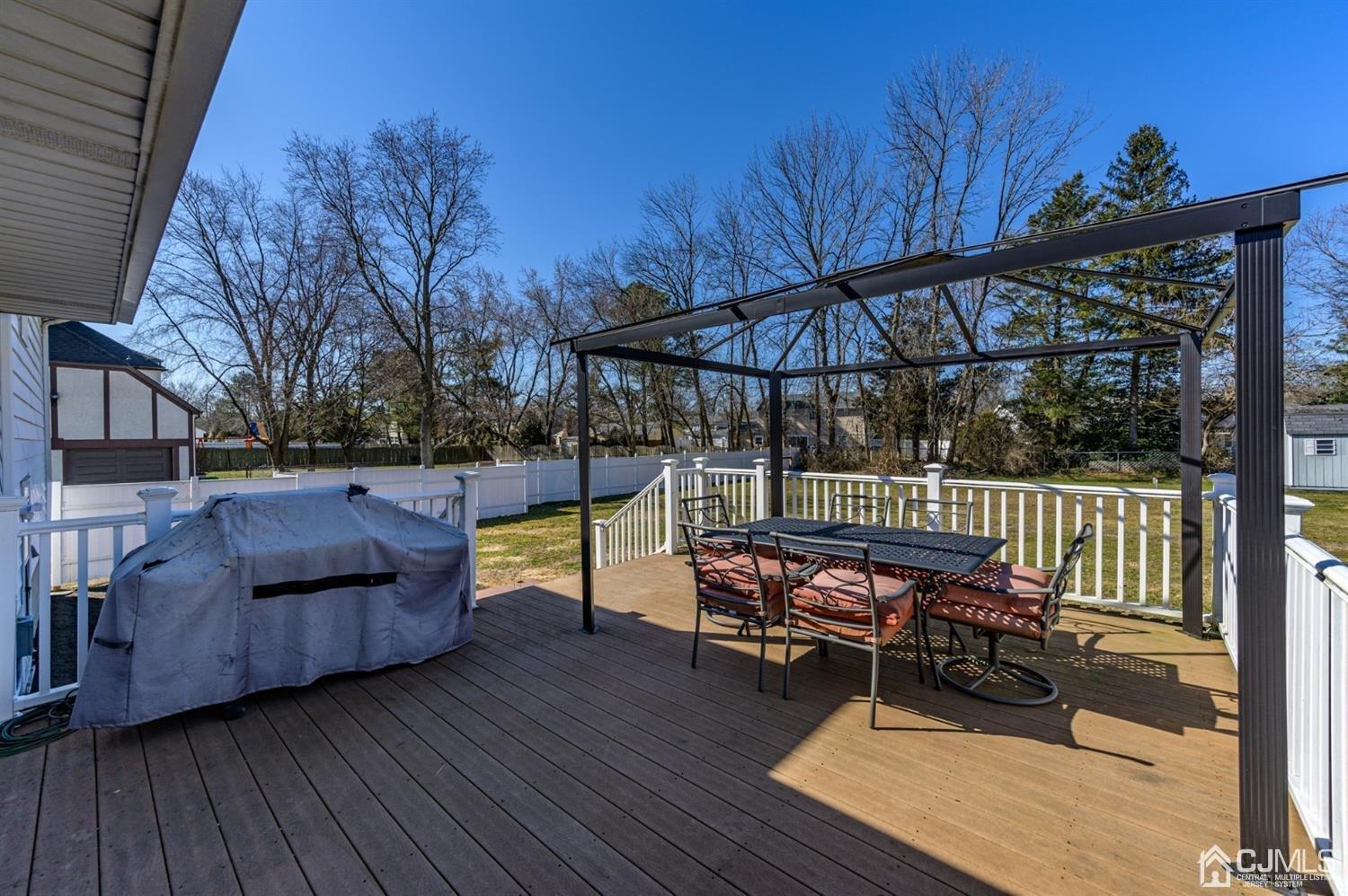 627 Lloyd Road Aberdeen, NJ 07747 - Photo 25 of 32 a view of a roof deck with chair and wooden floor