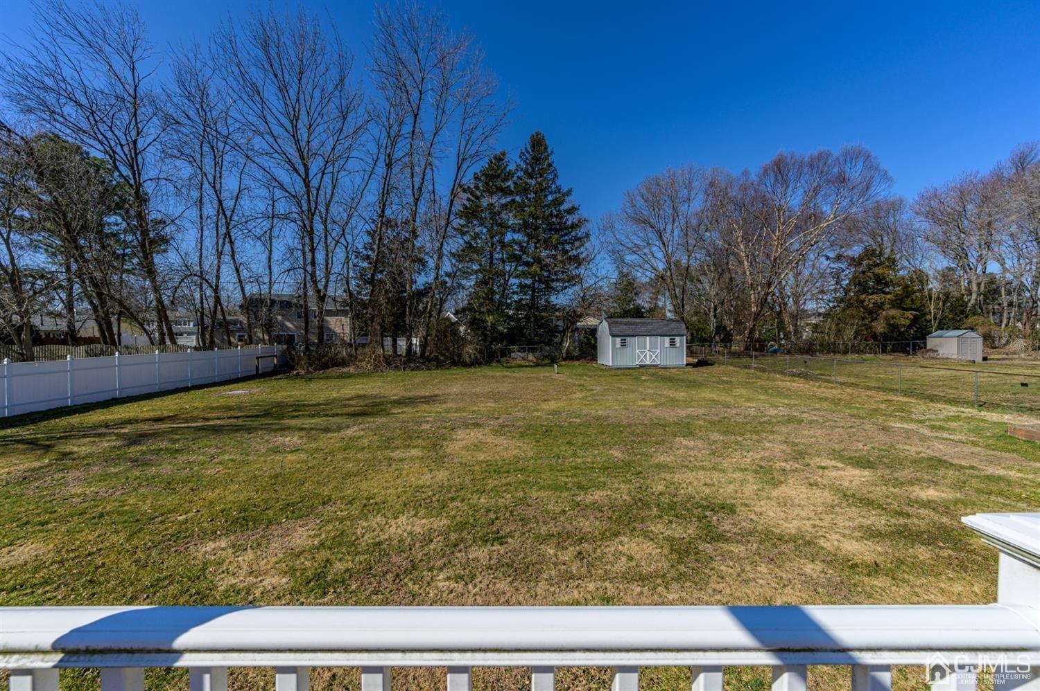 627 Lloyd Road Aberdeen, NJ 07747 - Photo 26 of 32 a view of yard with swimming pool and trees