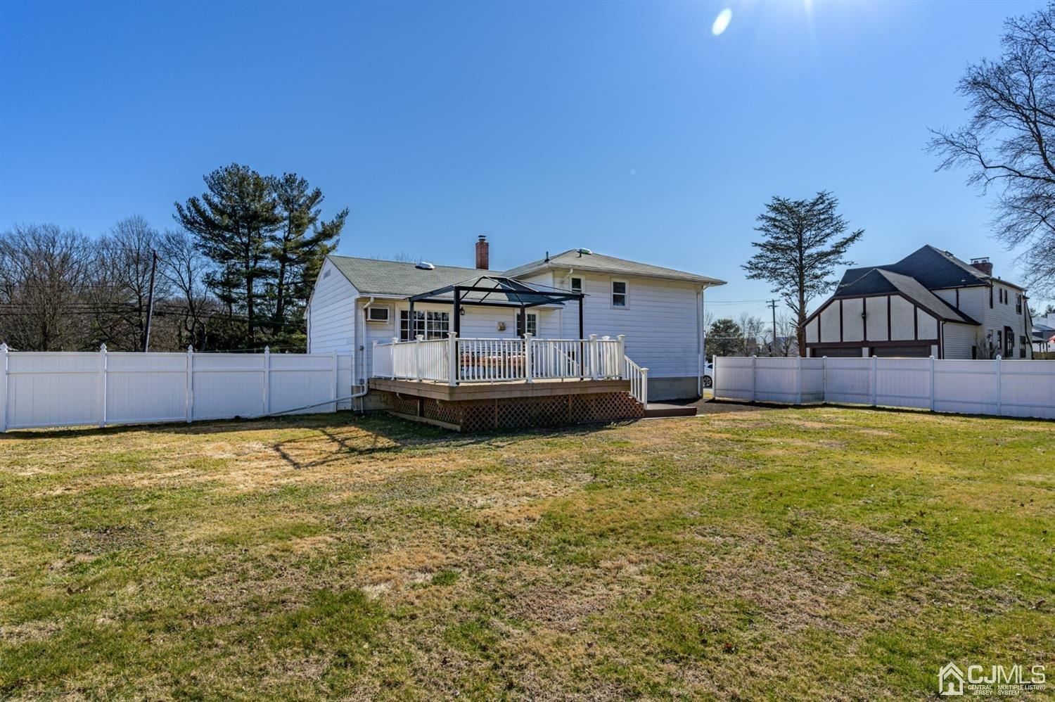 627 Lloyd Road Aberdeen, NJ 07747 - Photo 28 of 32 a house view with swimming pool in front of it