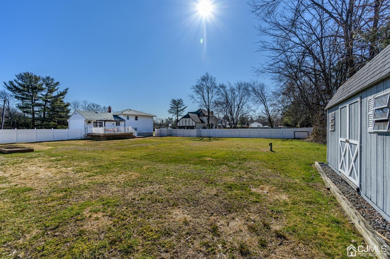 627 Lloyd Road Aberdeen, NJ 07747 - Photo 29 of 32 a view of a swimming pool with an outdoor seating and house in the background