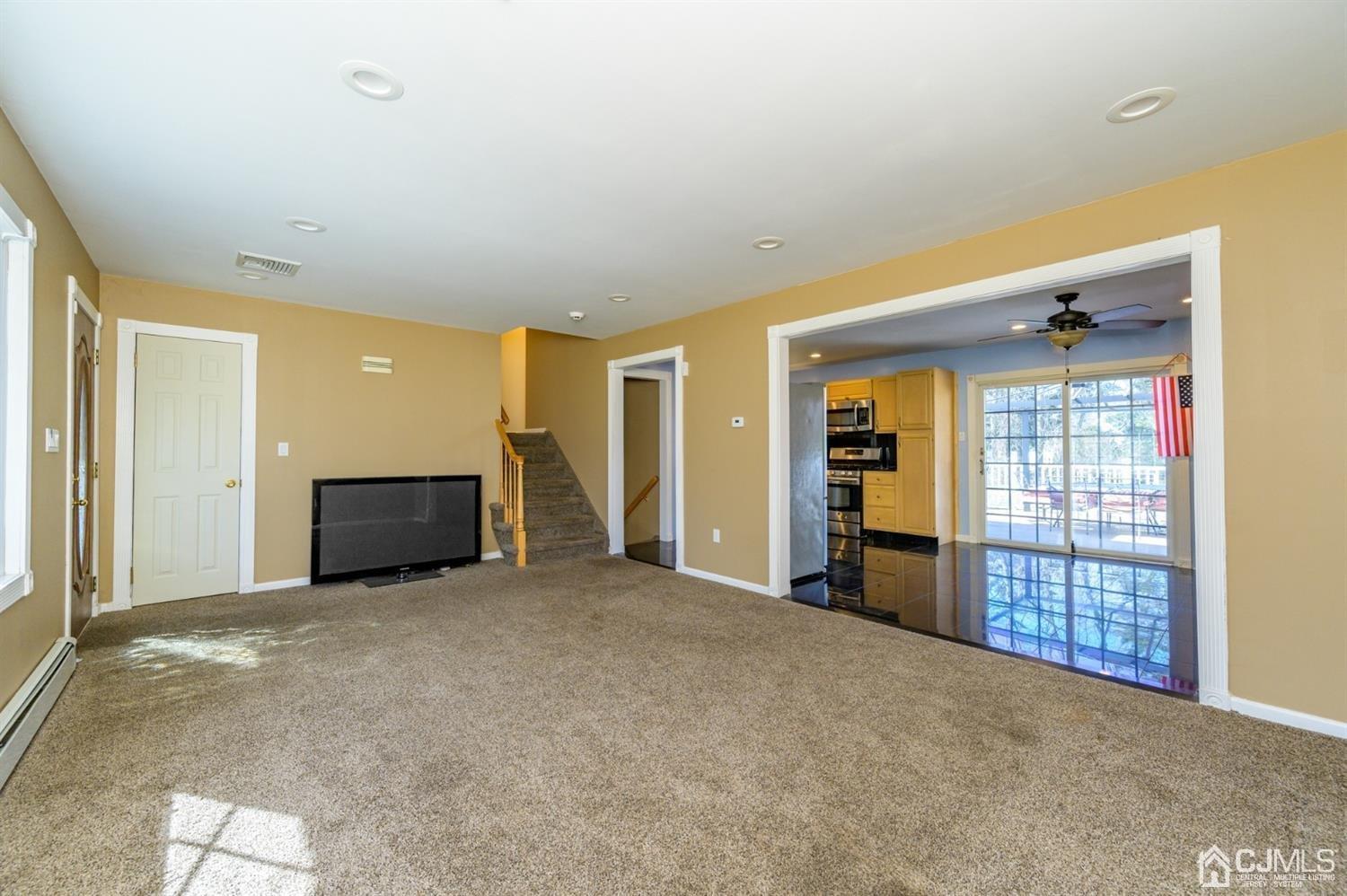 627 Lloyd Road Aberdeen, NJ 07747 - Photo 5 of 32 a view of an empty room with window and cabinet
