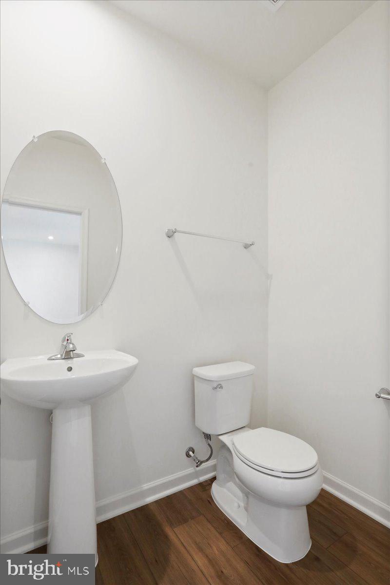 71 Stafford Place Falling Waters, WV 25419 - Photo 18 of 48 a bathroom with a toilet a sink and mirror