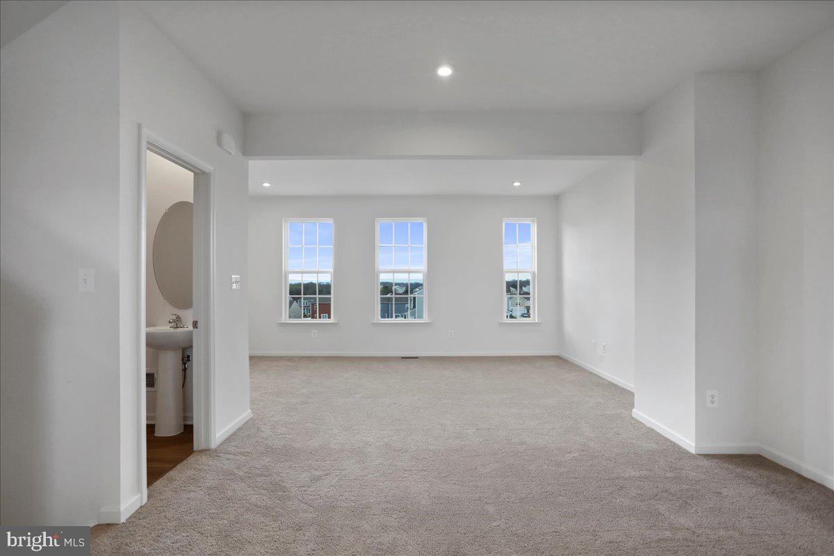71 Stafford Place Falling Waters, WV 25419 - Photo 20 of 48 an empty room with a bench and mirrors