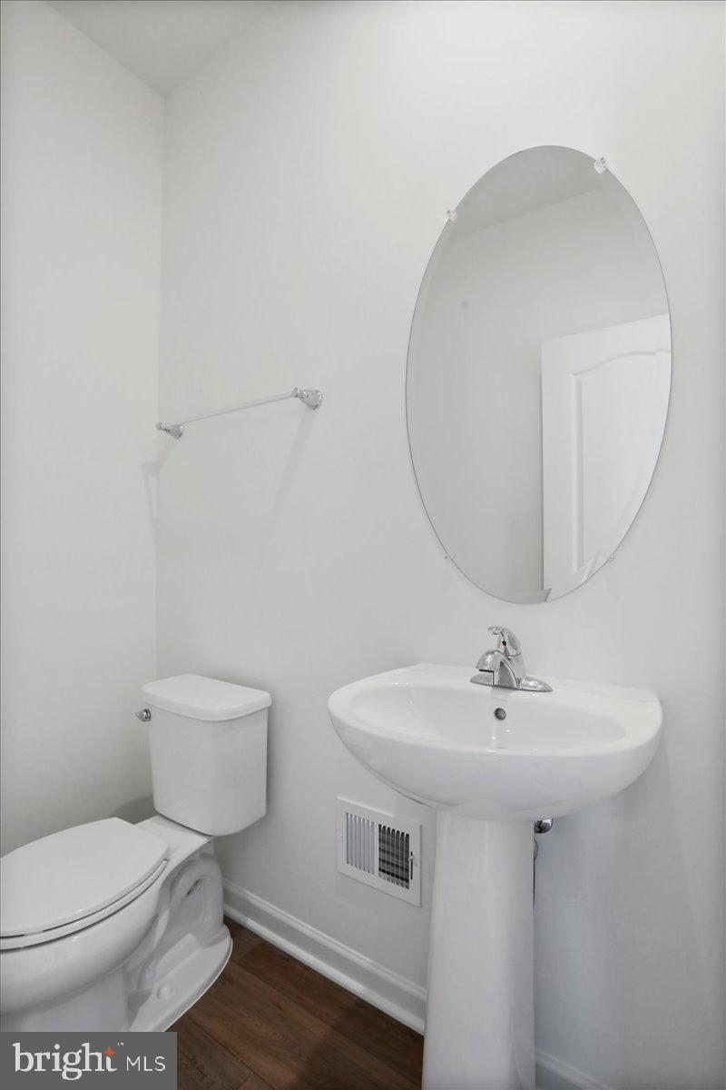 71 Stafford Place Falling Waters, WV 25419 - Photo 22 of 48 a bathroom with a sink toilet and a mirror