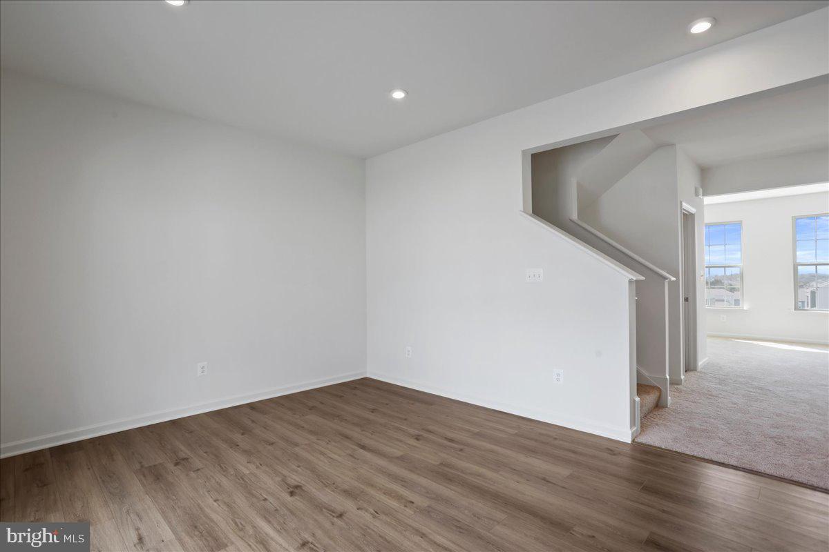 71 Stafford Place Falling Waters, WV 25419 - Photo 25 of 48 a view of empty room with wooden floor