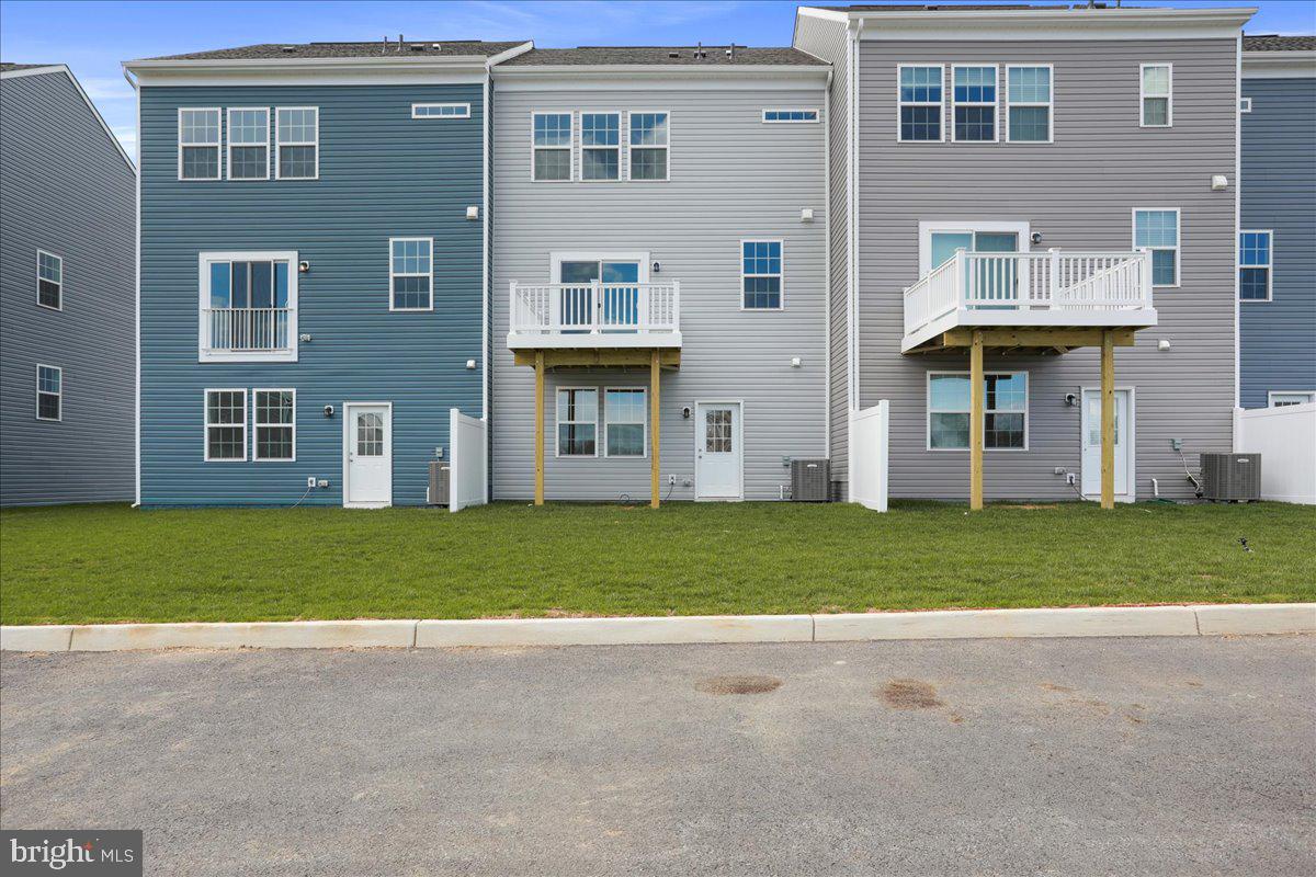71 Stafford Place Falling Waters, WV 25419 - Photo 41 of 48 a front view of house with yard and trees
